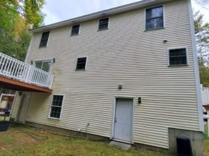 Southern Maine Power and Pressure Washing. Back of house, cleaning, with deck and lawn.